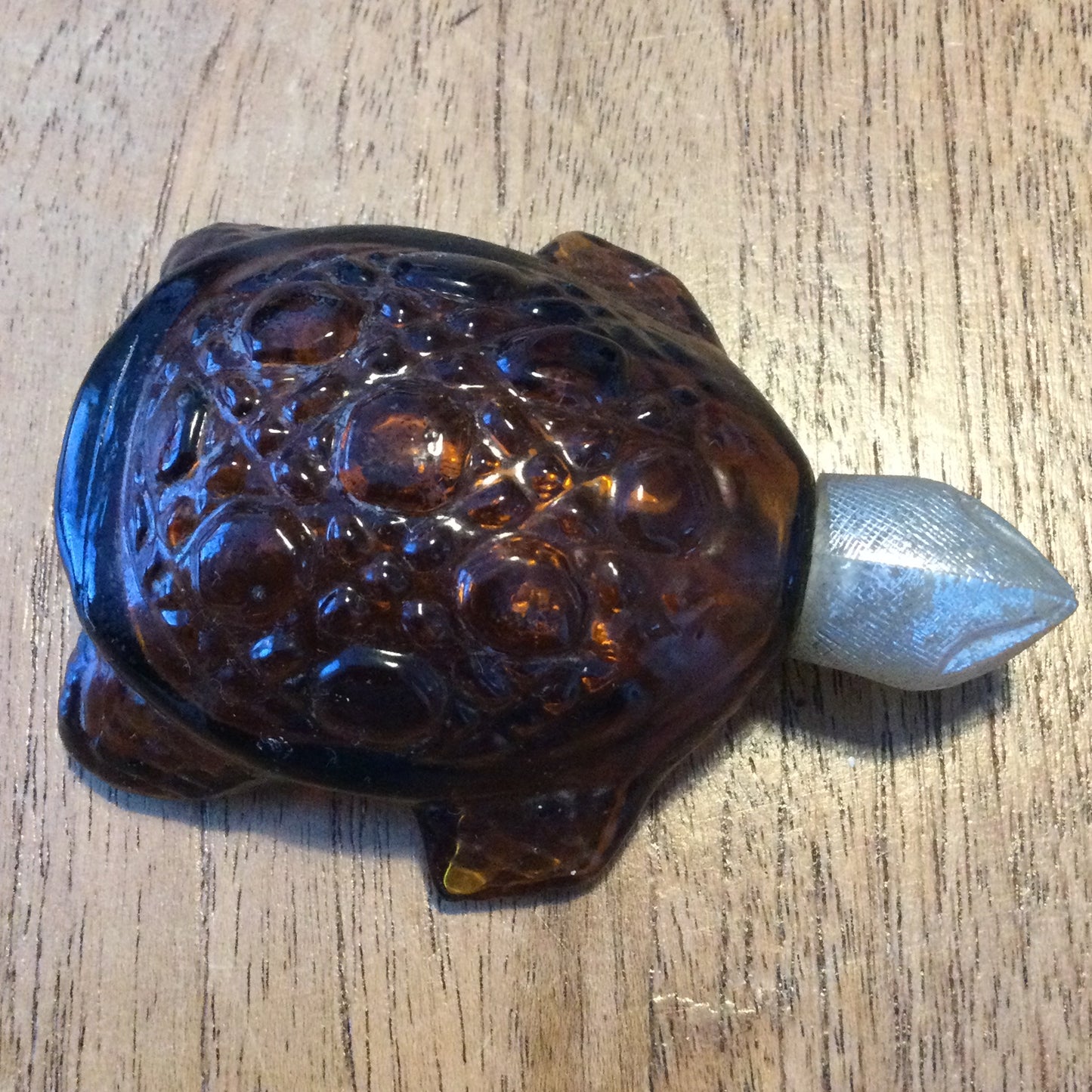 Vintage Avon Tai Winds Turtle shape collectible aftershave bottle. Empty. Retro brown glass.