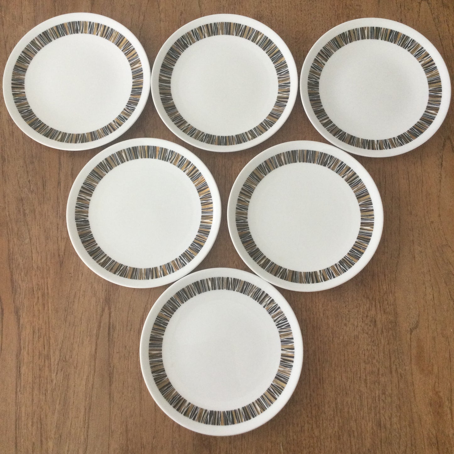 1960s Royal Tuscan Wedgwood Cascade set of 6 side plates. Black and gold retro stripes on white china.