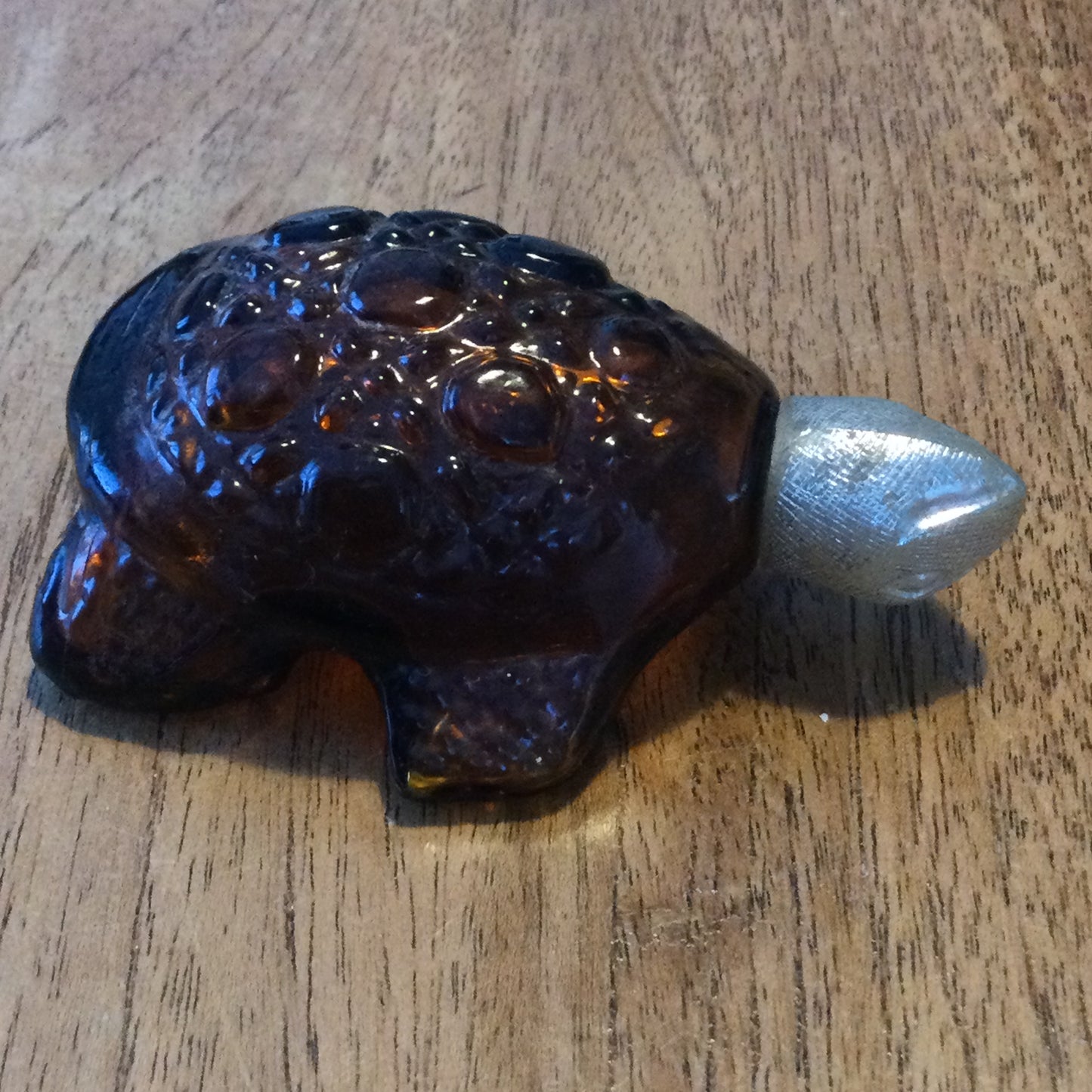 Vintage Avon Tai Winds Turtle shape collectible aftershave bottle. Empty. Retro brown glass.
