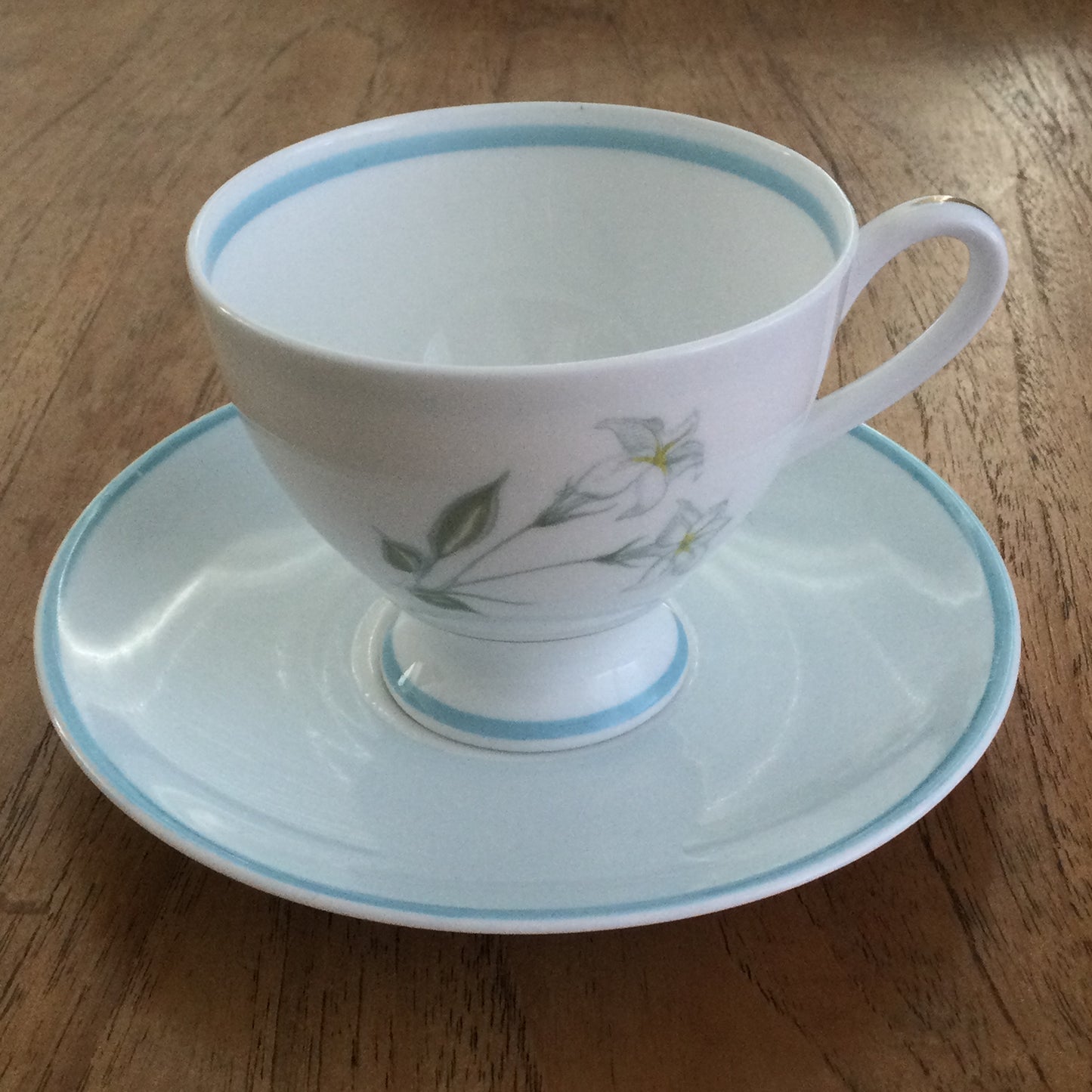 Vintage Susie Cooper bone china tea cup and saucer. Pastel blue floral design. 1960s