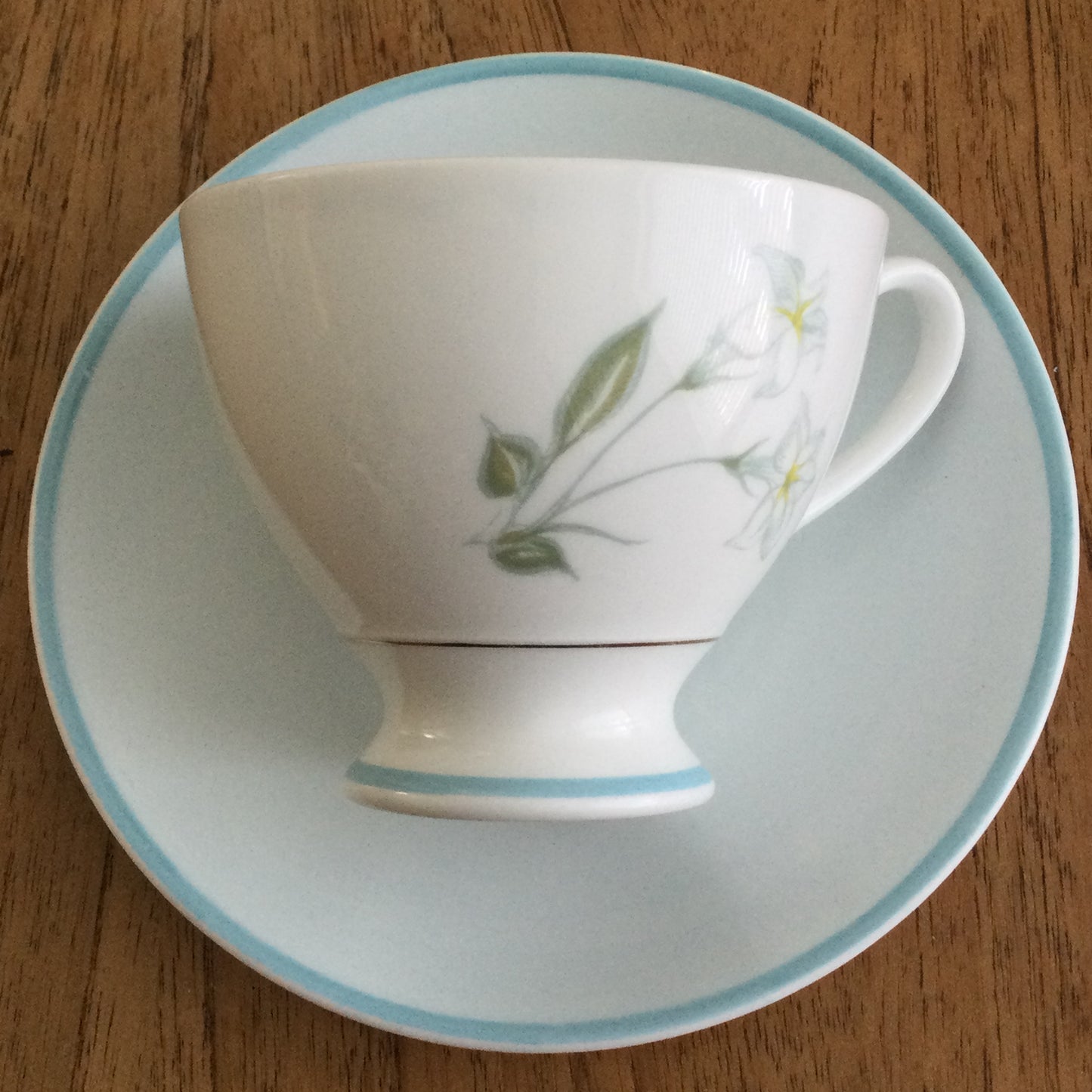 Vintage Susie Cooper bone china tea cup and saucer. Pastel blue floral design. 1960s