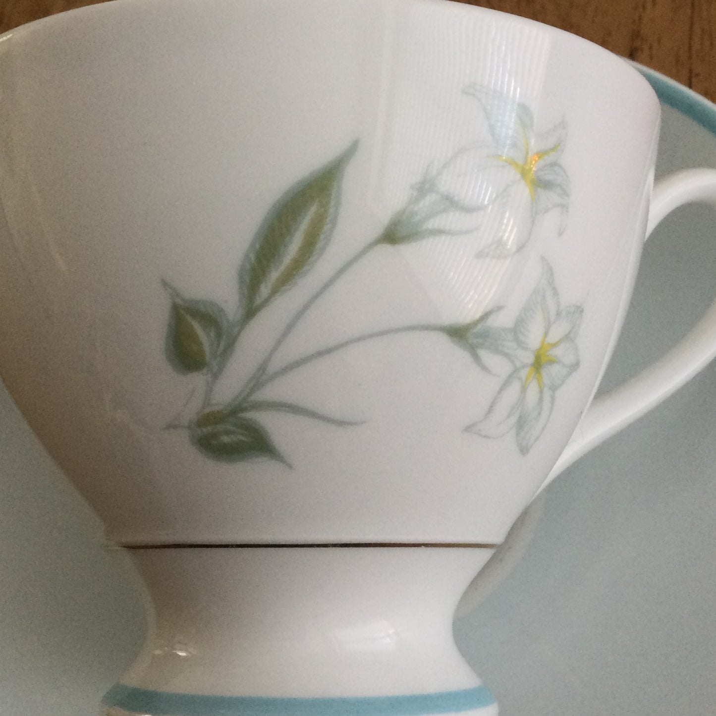 Vintage Susie Cooper bone china tea cup and saucer. Pastel blue floral design. 1960s