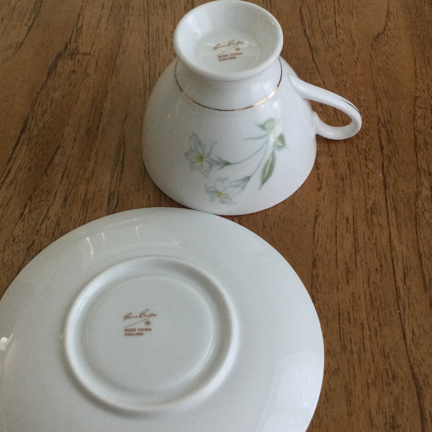 Vintage Susie Cooper bone china tea cup and saucer. Pastel blue floral design. 1960s