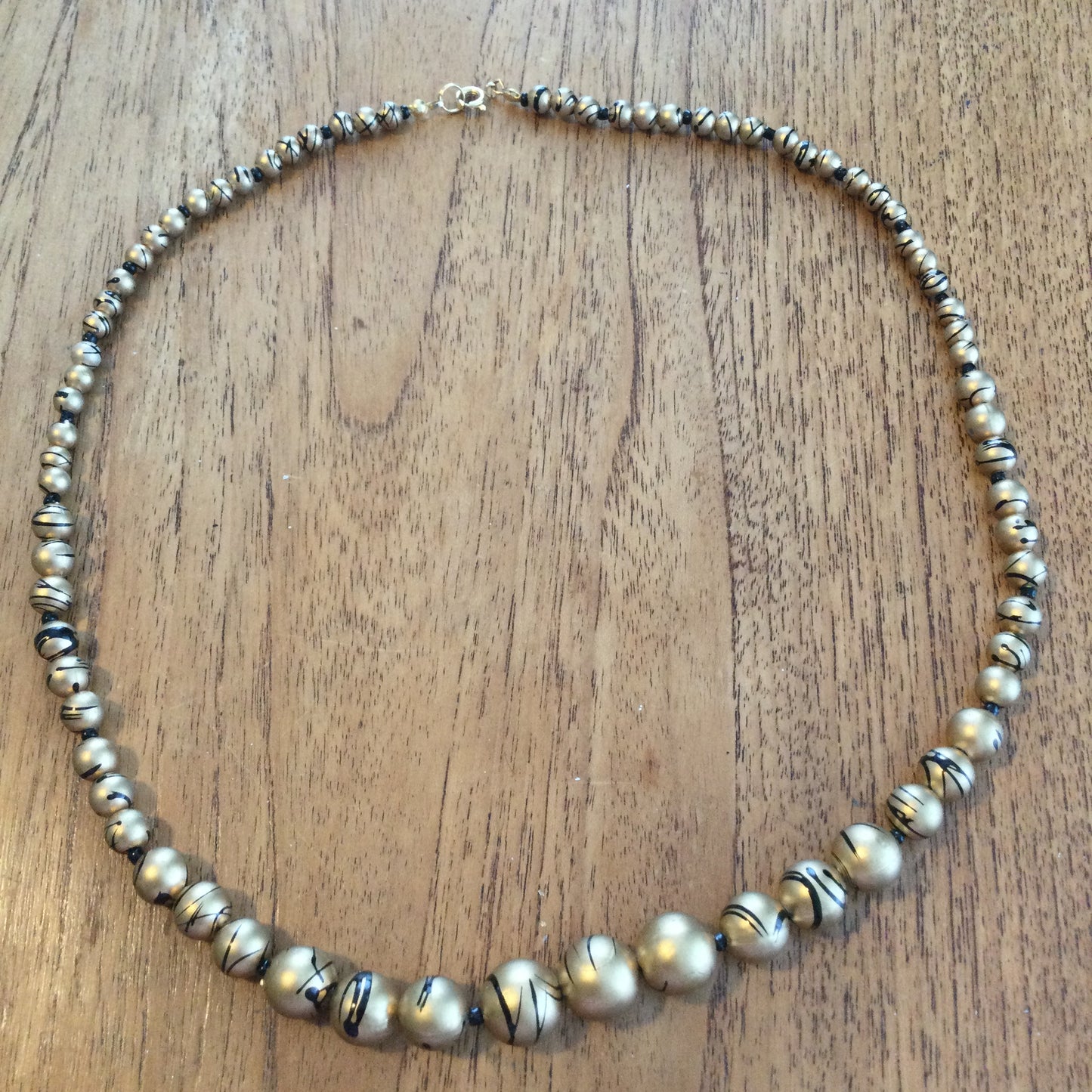 Vintage Gold Coloured Graduated Bead Necklace With Black Splash Design 50s 60s 80s retro vibes