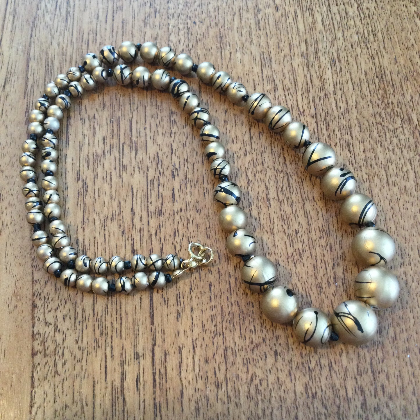 Vintage Gold Coloured Graduated Bead Necklace With Black Splash Design 50s 60s 80s retro vibes