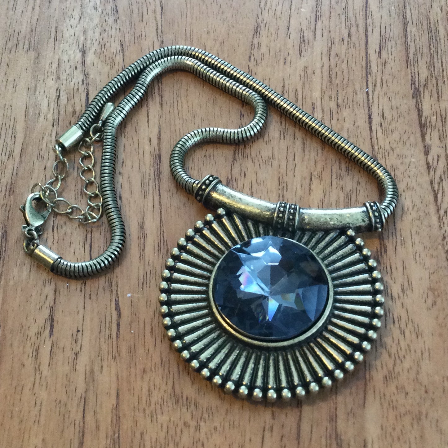 Per Una Antique Gold / Brass Tone Statement Necklace. Medallion shape pendant with grey crystal stone.Bold Design