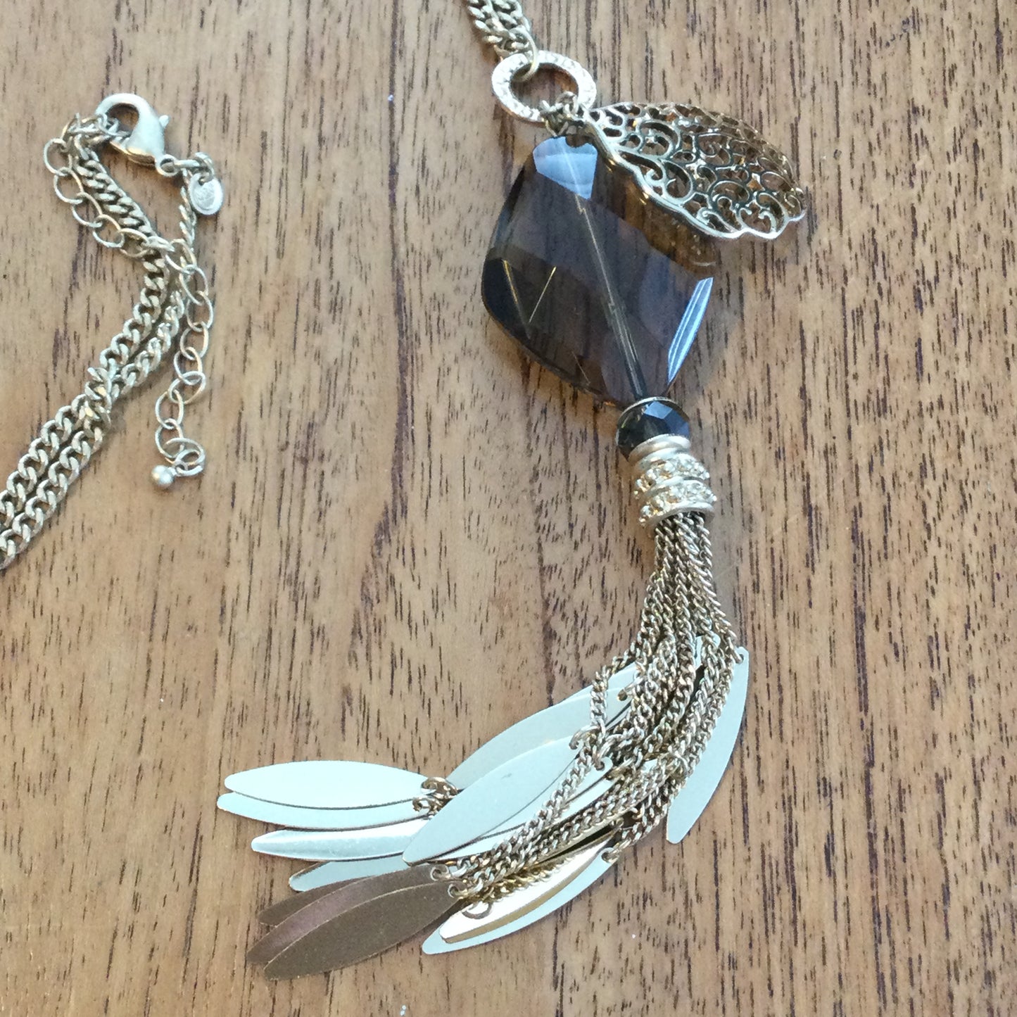 M&S Statement Necklace. Long 28". Dangling pendant gold tone with smokey quartz colour large glass bead. Boho feel