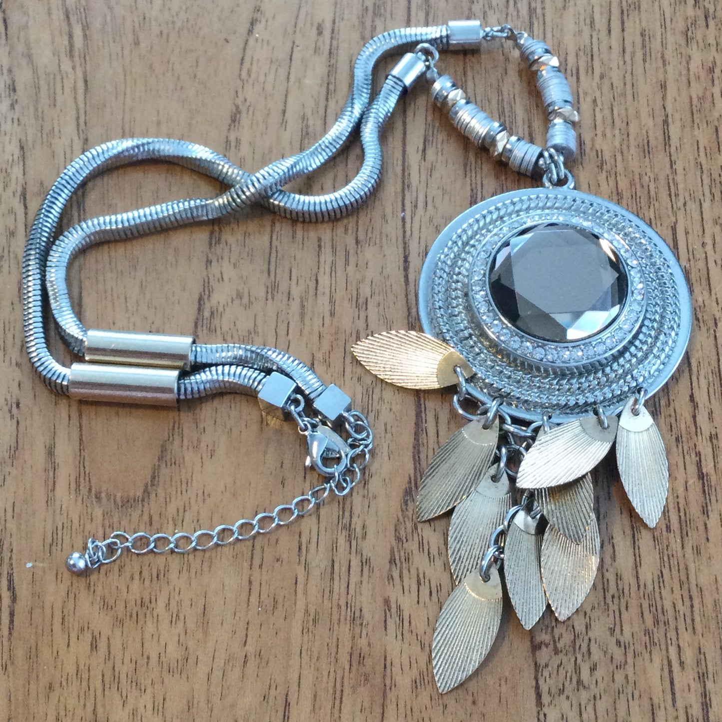 Per Una Dangle Necklace 2 Tone Metal Chunky Statement Jewellery. Leaf / feather shape dangles with pale brown cut glass stone