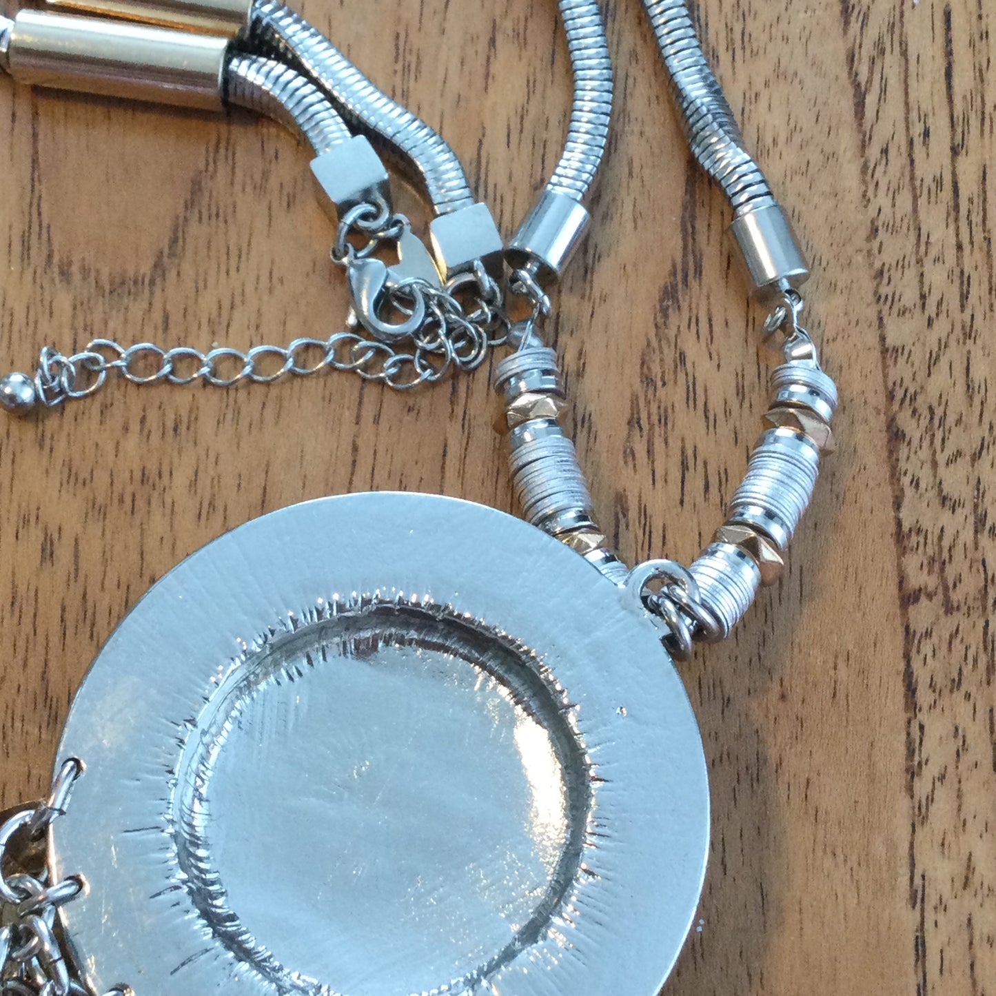 Per Una Dangle Necklace 2 Tone Metal Chunky Statement Jewellery. Leaf / feather shape dangles with pale brown cut glass stone