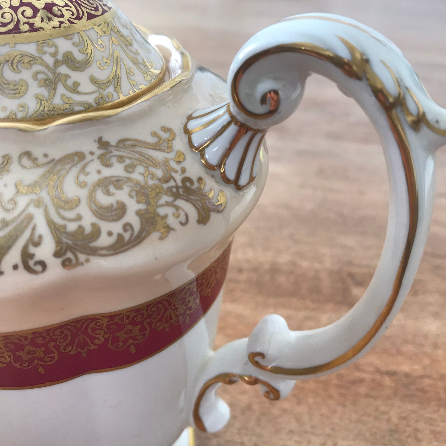 Vintage Paragon coffee pot. White, cream, burgundy and gold. Ornate design. Fancy handle and spout.
