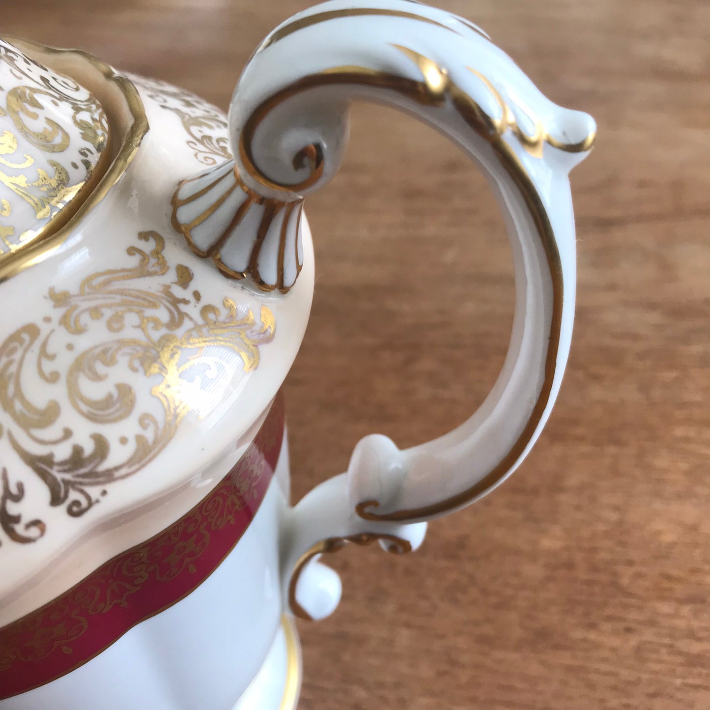 Vintage Paragon coffee pot. White, cream, burgundy and gold. Ornate design. Fancy handle and spout.