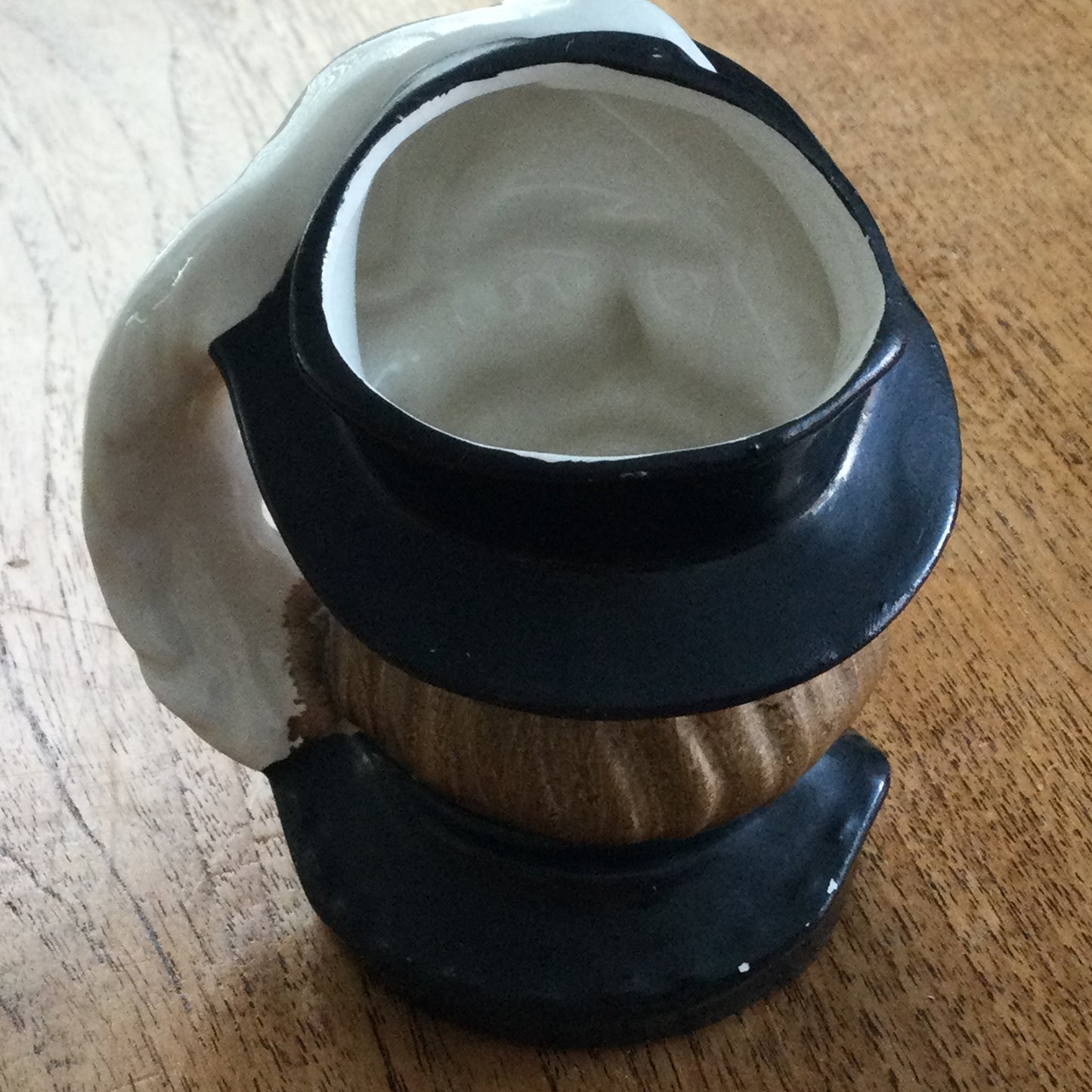 Vintage Shakespeare character / toby mug. Plume is the handle. Black and white. Some damage.