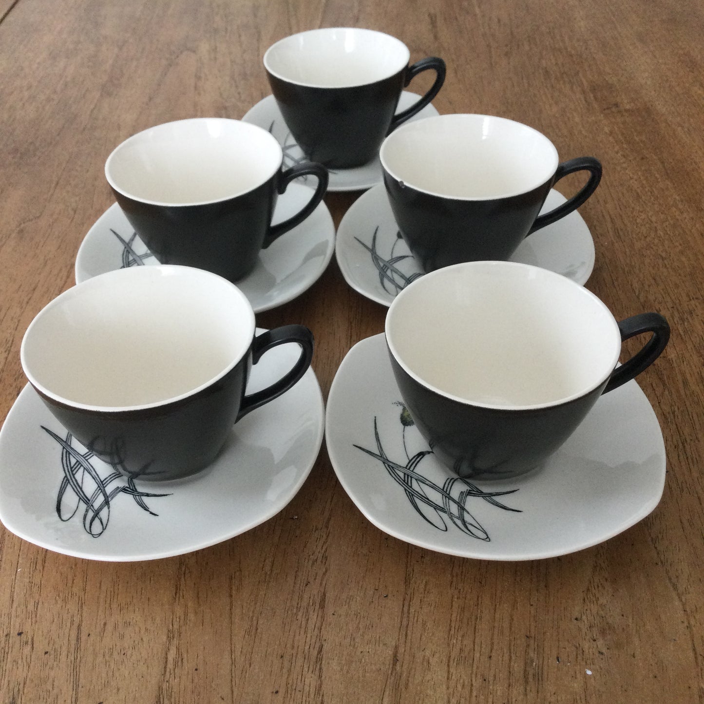 Set of 5 demitasse coffee cups and saucers. Midwinter Bali Hai grasses design by John Russell.