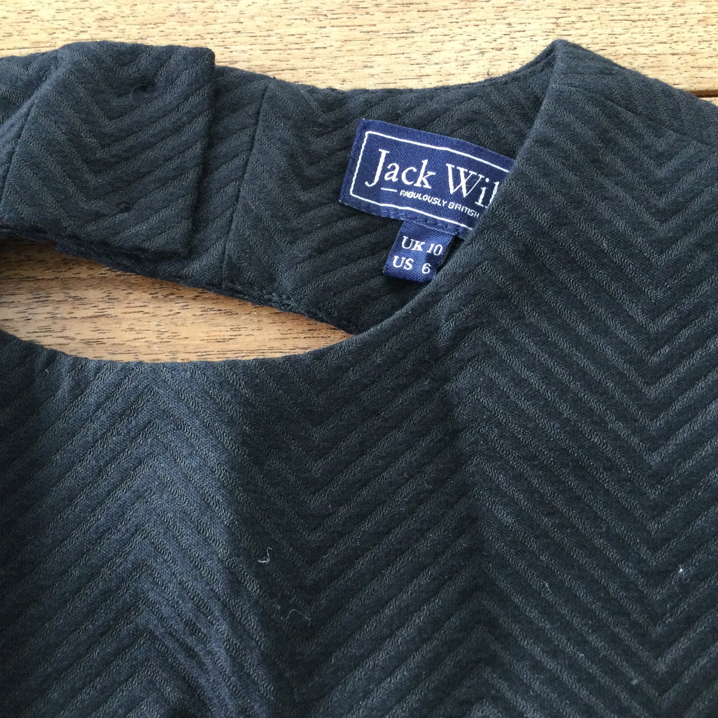 Black skater dress, cut out back, Jack Wills size 10. Herringbone pattern, thick structured fabric.