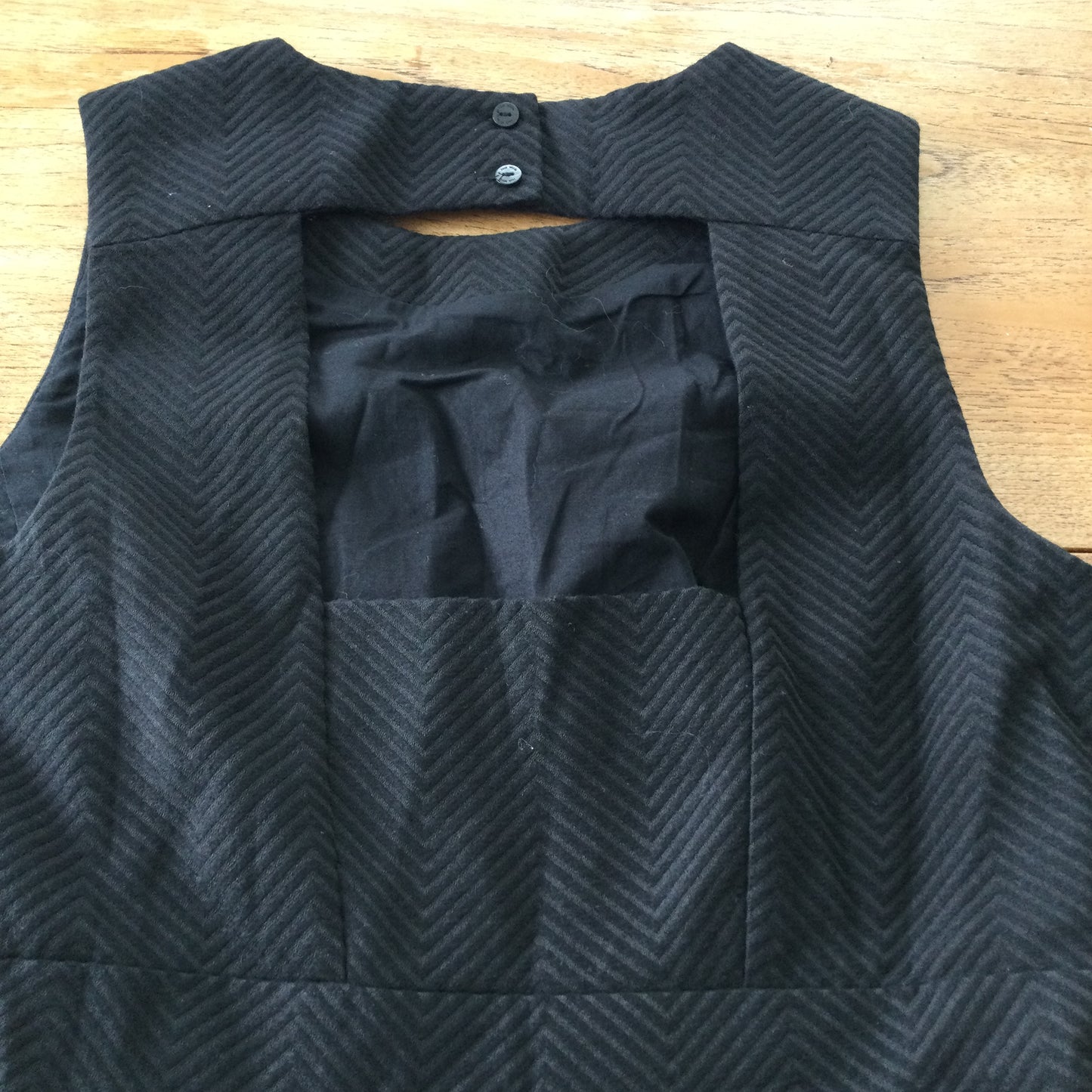 Black skater dress, cut out back, Jack Wills size 10. Herringbone pattern, thick structured fabric.