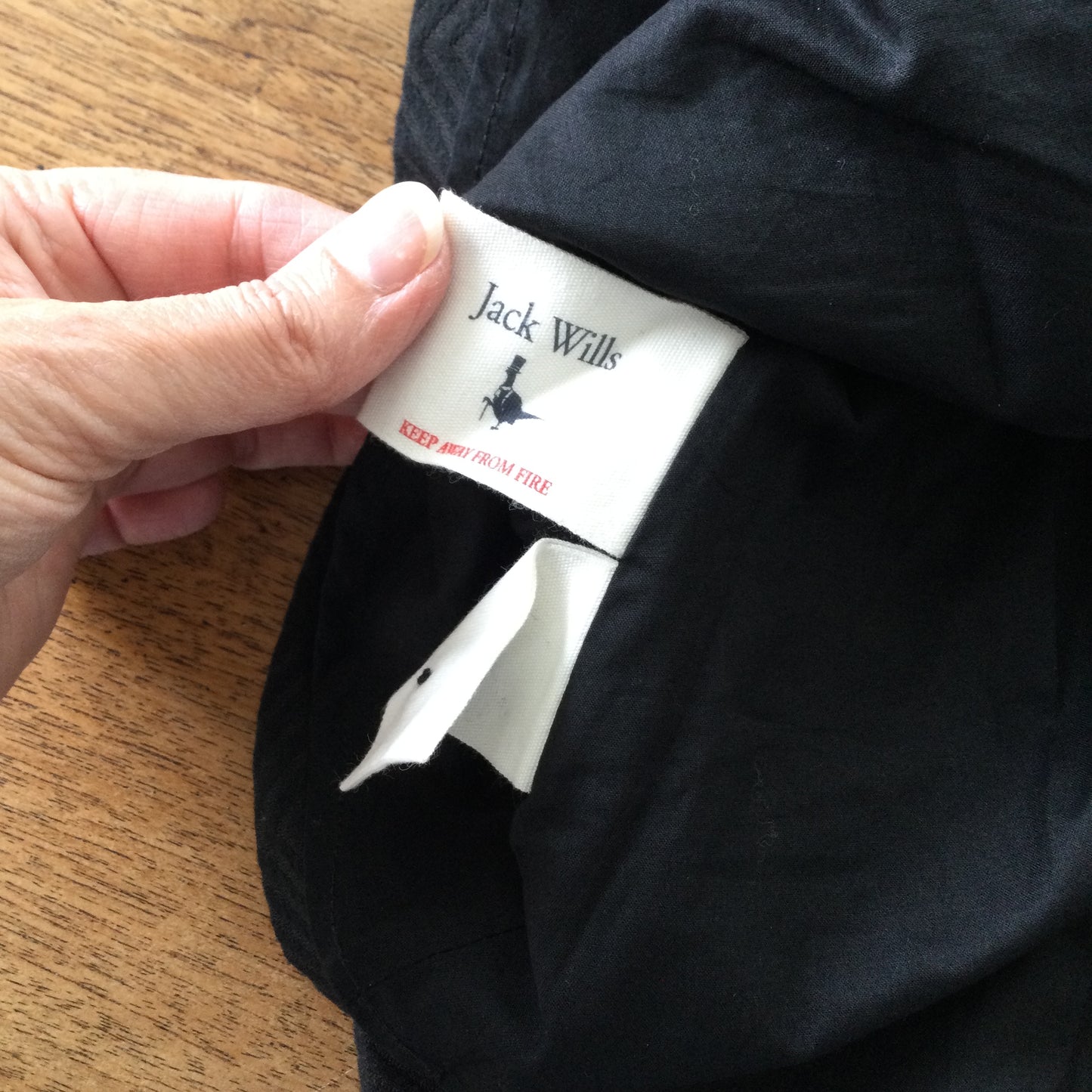 Black skater dress, cut out back, Jack Wills size 10. Herringbone pattern, thick structured fabric.