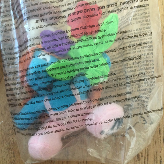 McDonald’s collectable SMURF TOY MAY 5/2000. Smurf with pigtails holding bunch of flowers