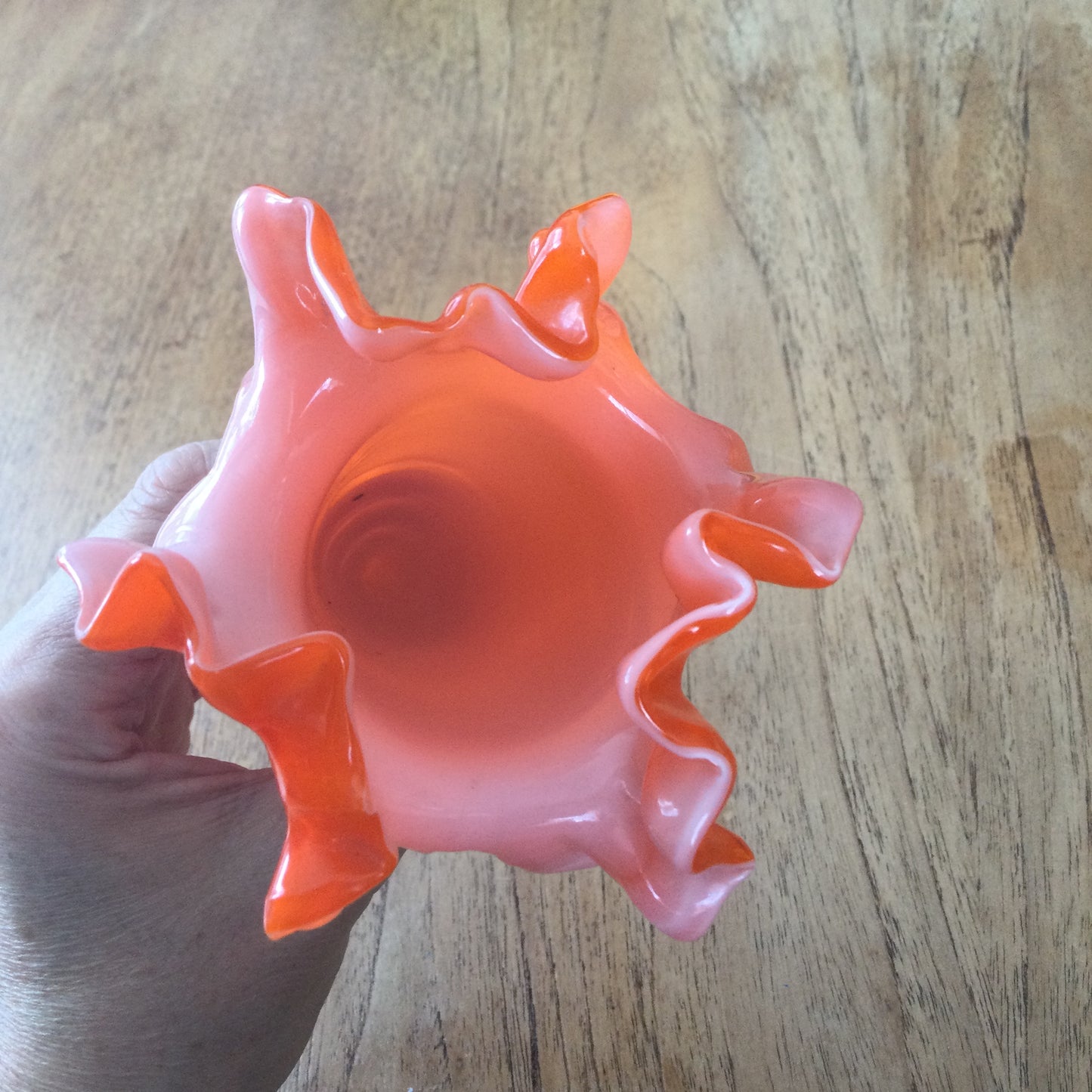 Mid century 1960s orange Murano style vase. Chinese Plum Blossom. Frilly fluted edge. Stemmed bottom.
