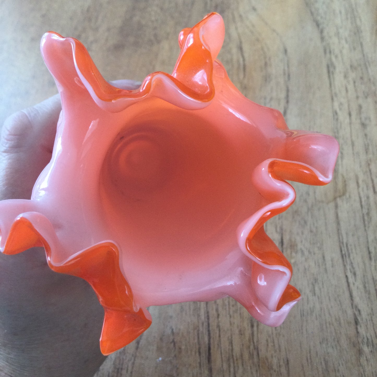 Mid century 1960s orange Murano style vase. Chinese Plum Blossom. Frilly fluted edge. Stemmed bottom.