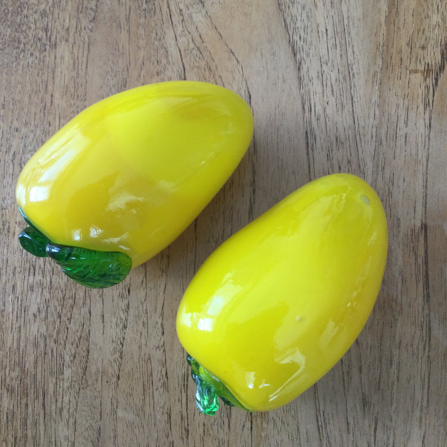 Pair of bright yellow and green art glass pepper ornaments / paperweights. Glass salad vegetables.
