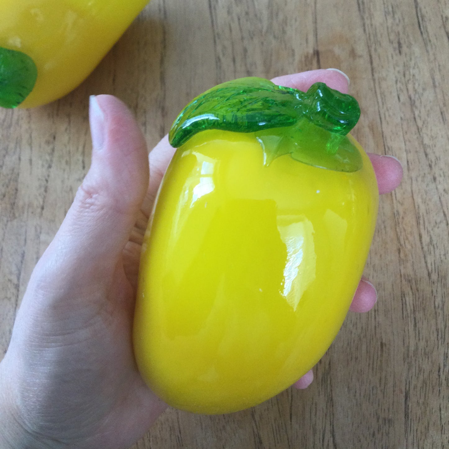 Pair of bright yellow and green art glass pepper ornaments / paperweights. Glass salad vegetables.