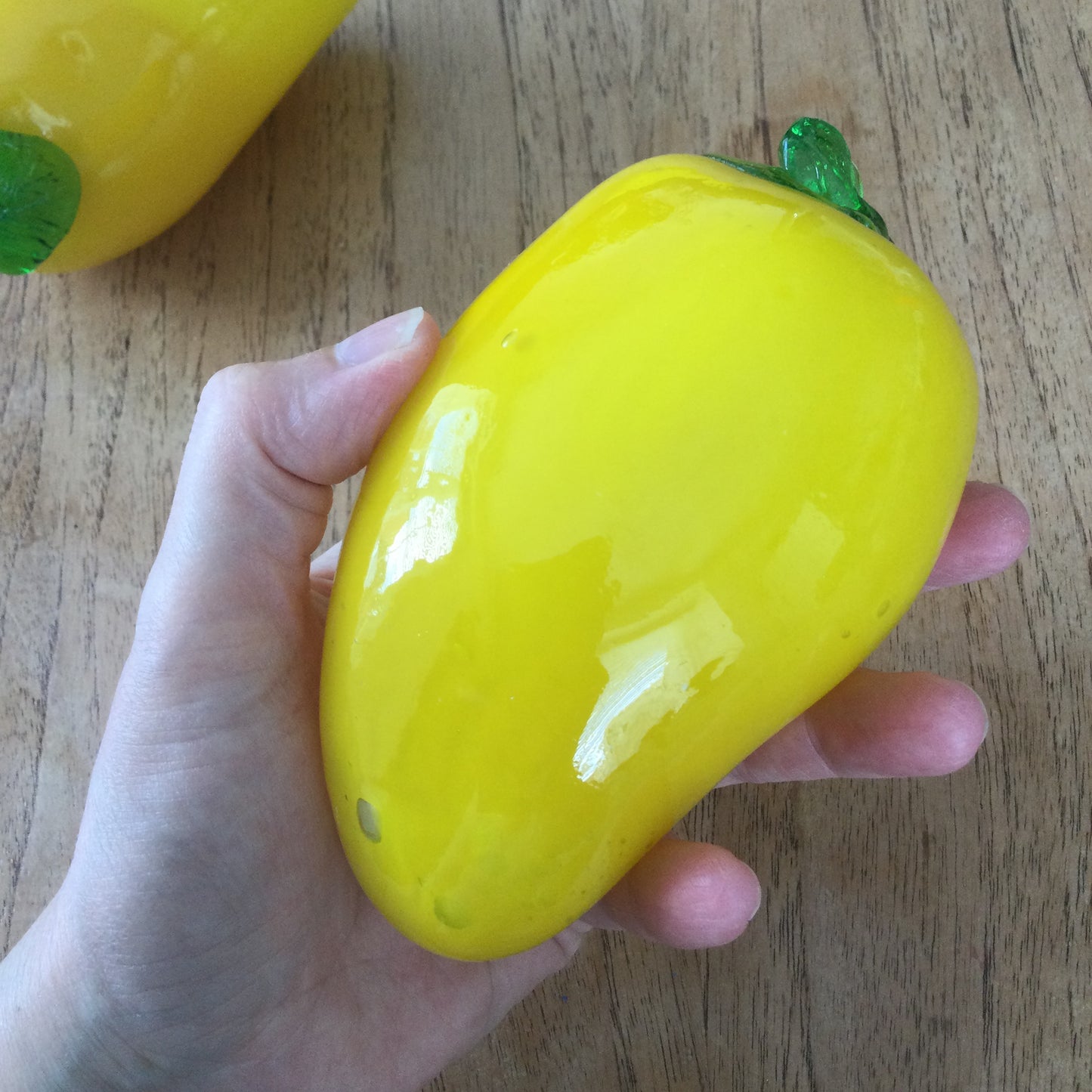 Pair of bright yellow and green art glass pepper ornaments / paperweights. Glass salad vegetables.