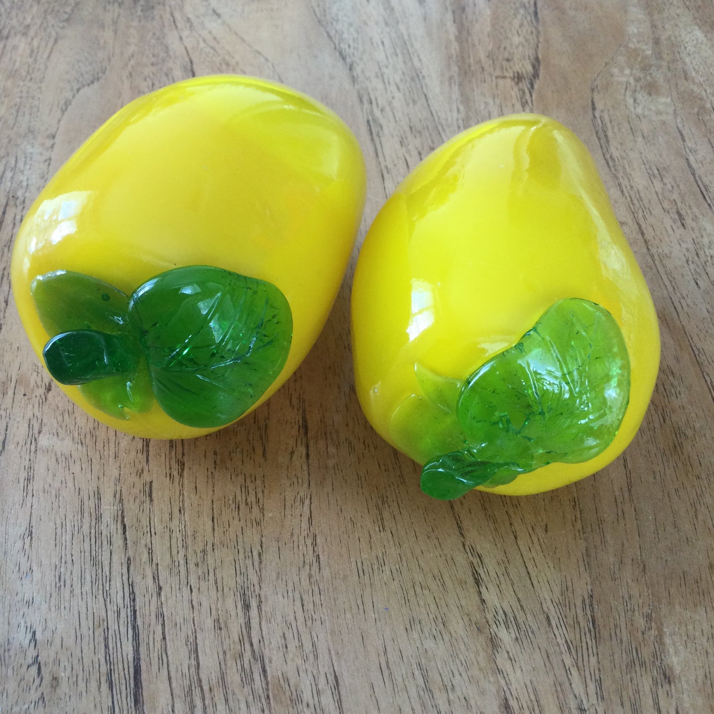 Pair of bright yellow and green art glass pepper ornaments / paperweights. Glass salad vegetables.