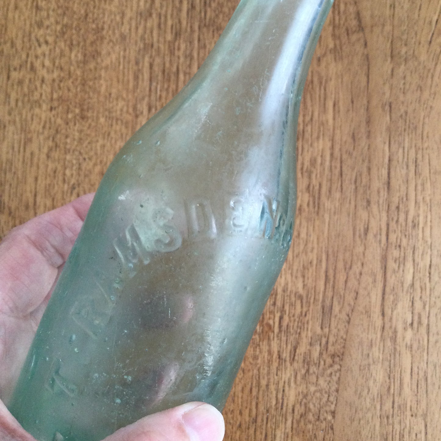 Antique Victorian clear green glass bottle. T. Ramsden & Son Ltd Halifax