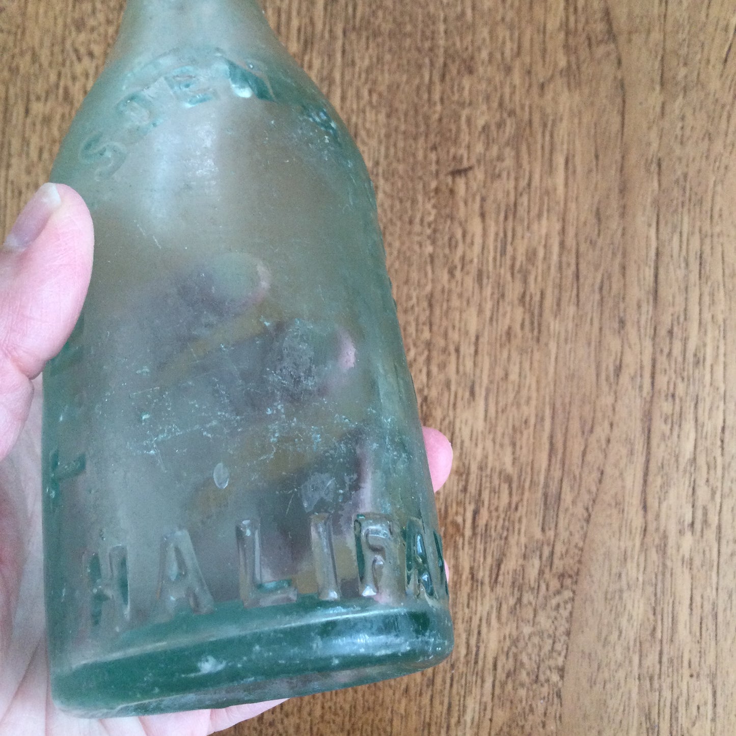 Antique Victorian clear green glass bottle. T. Ramsden & Son Ltd Halifax