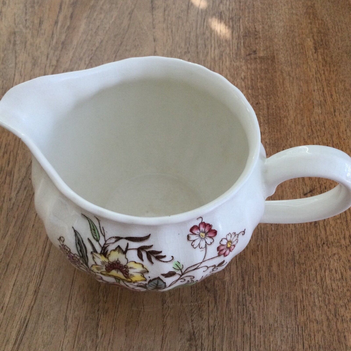 Pretty vintage floral jug Dee Cee cream pink yellow green pastels 12cm Cranbrook. Bulbous round shape.