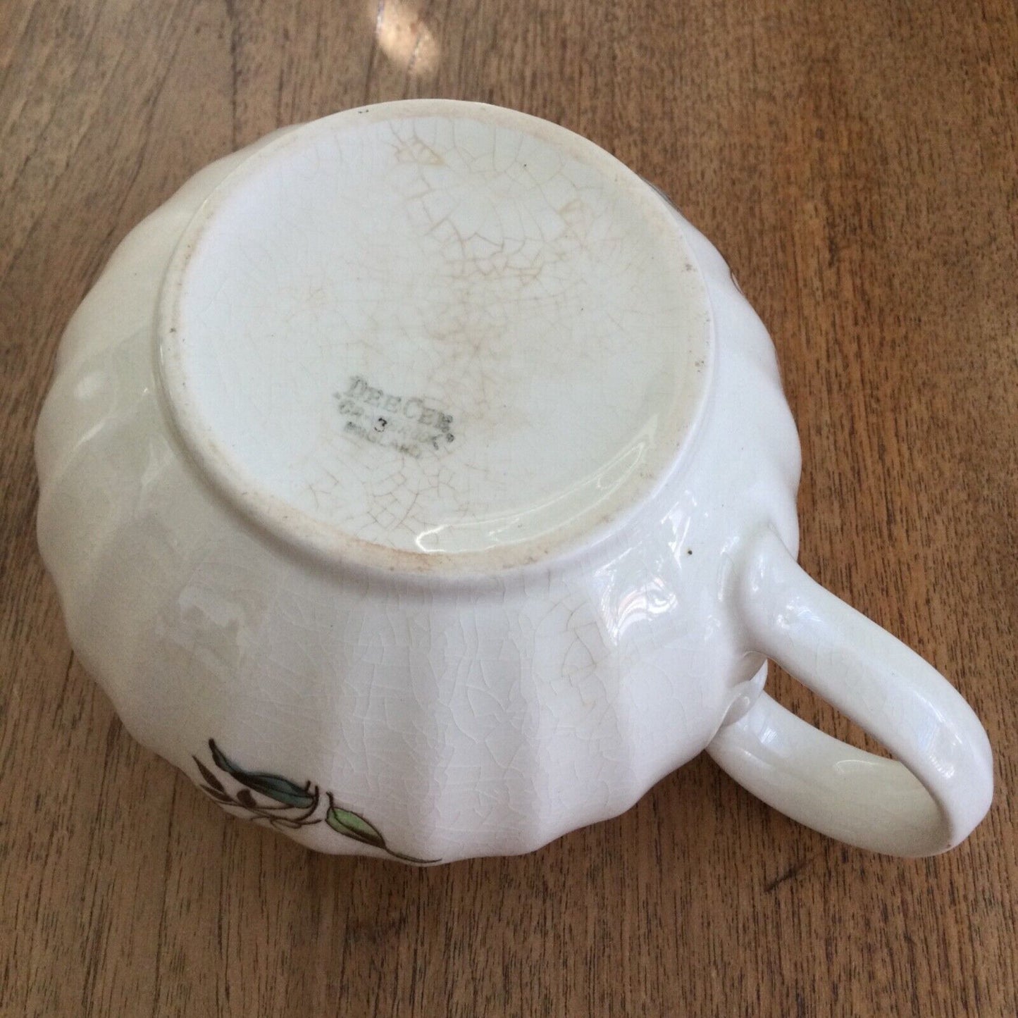 Pretty vintage floral jug Dee Cee cream pink yellow green pastels 12cm Cranbrook. Bulbous round shape.