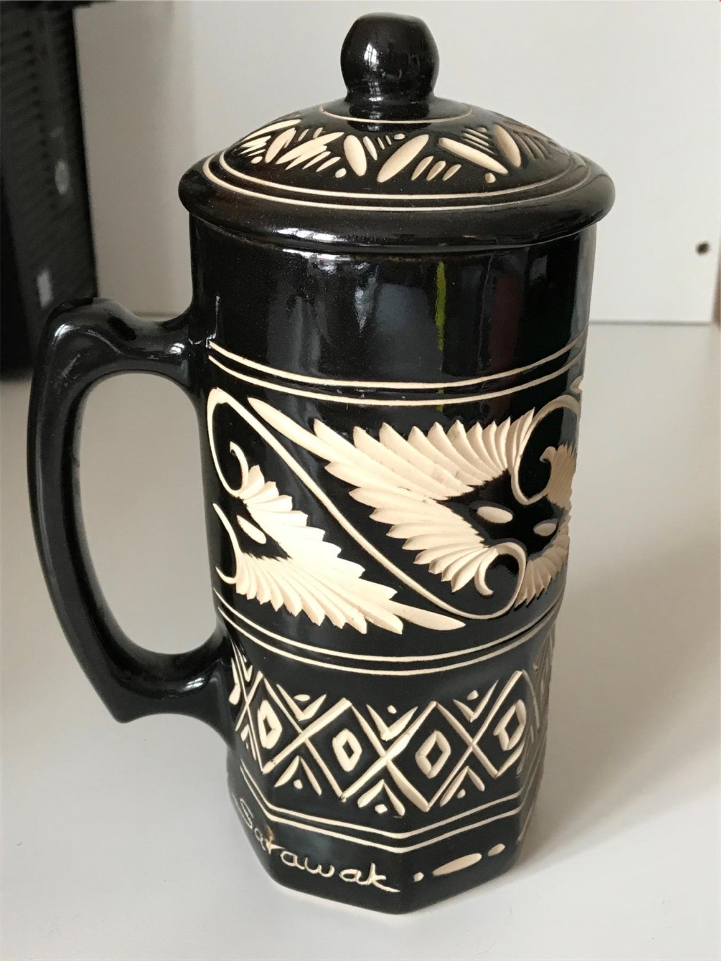 Striking black and cream pottery lidded tankard from Sarawak, Borneo, Malaysia.