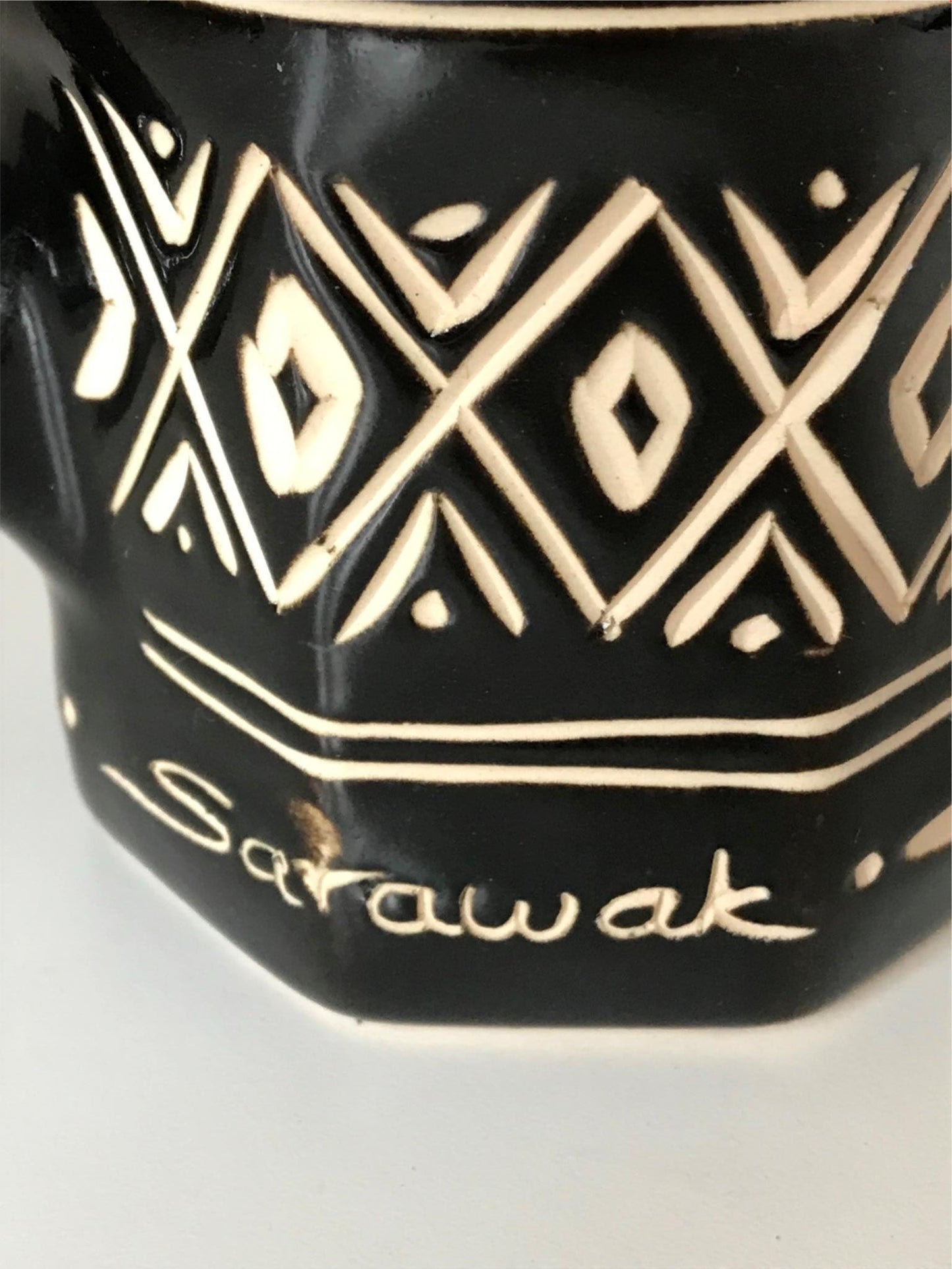 Striking black and cream pottery lidded tankard from Sarawak, Borneo, Malaysia.