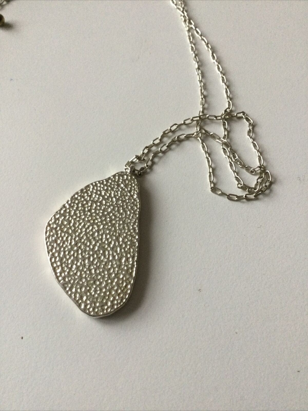 Pretty Silver Tone Necklace With Cream Coloured Pendant Geode Shaped.