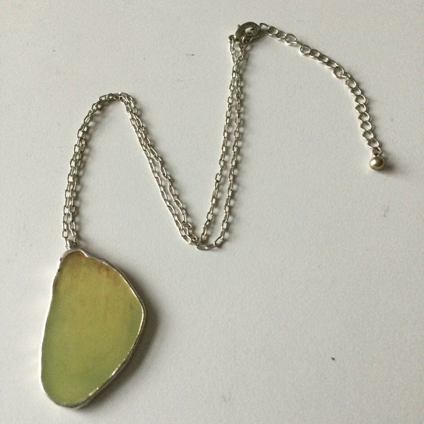 Pretty Silver Tone Necklace With Cream Coloured Pendant Geode Shaped.