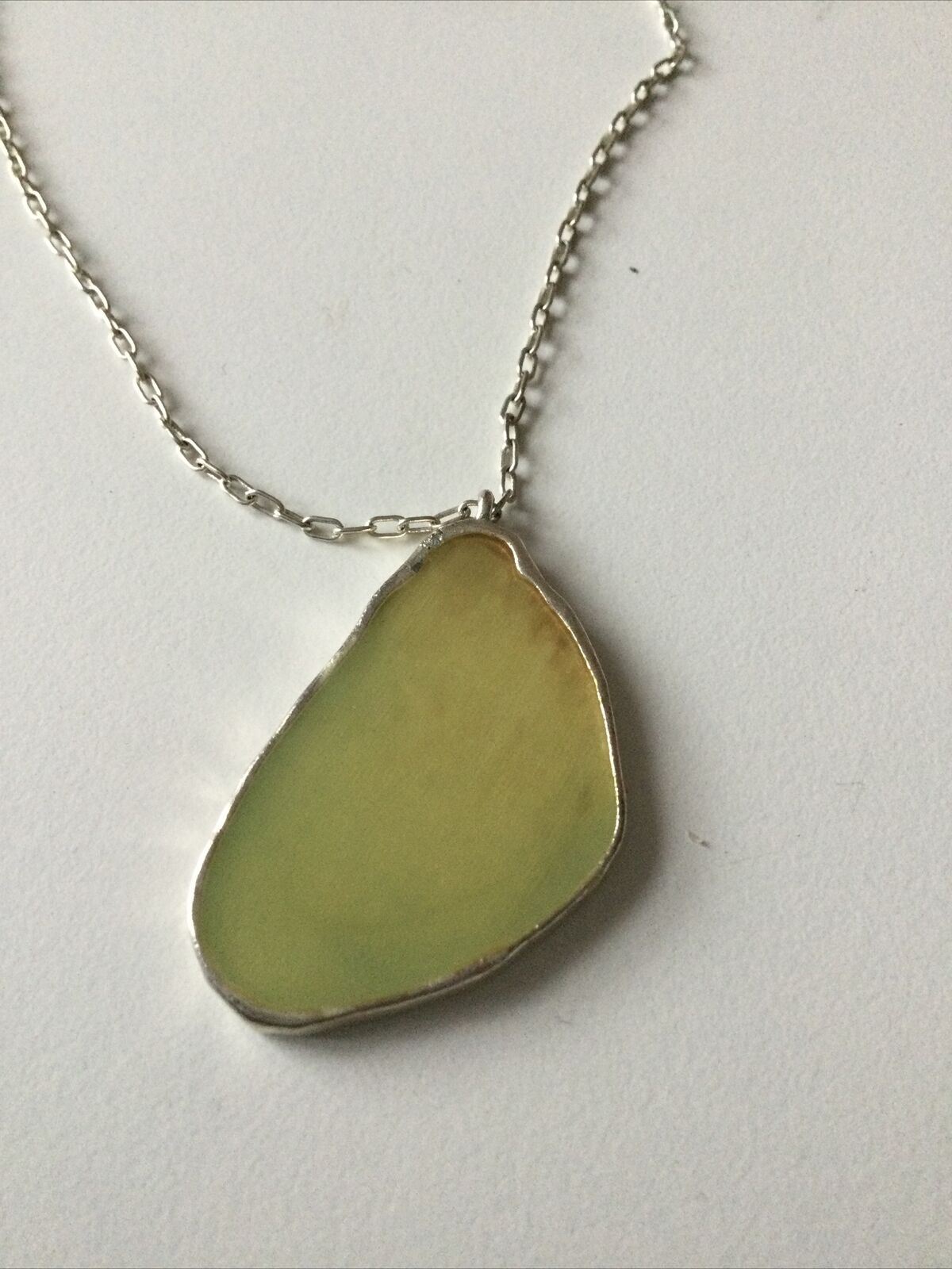 Pretty Silver Tone Necklace With Cream Coloured Pendant Geode Shaped.