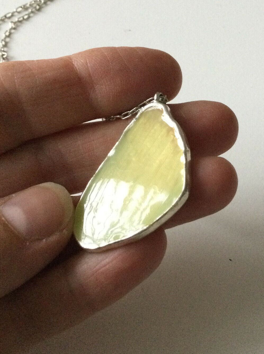 Pretty Silver Tone Necklace With Cream Coloured Pendant Geode Shaped.
