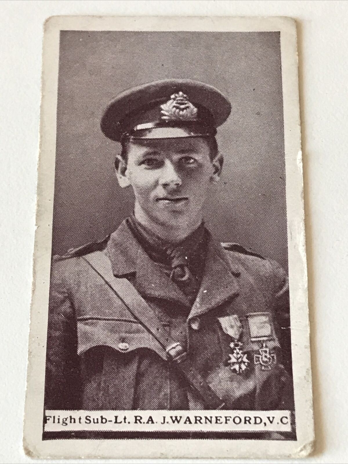 WILLS (SCISSORS) Britains Defenders (RED) #11 FLIGHT SUB-LT RA J WARNEFORD VC