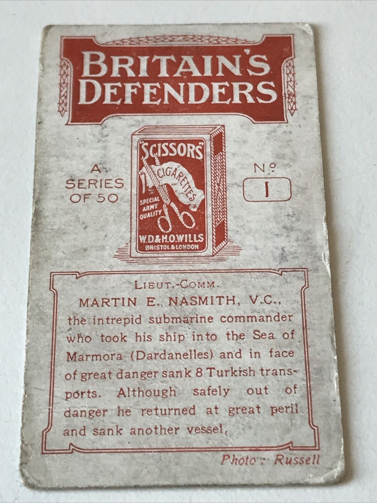 WILLS (SCISSORS) Britains Defenders (RED) #1 Lieut-Comm MARTIN E NASMITH VC card
