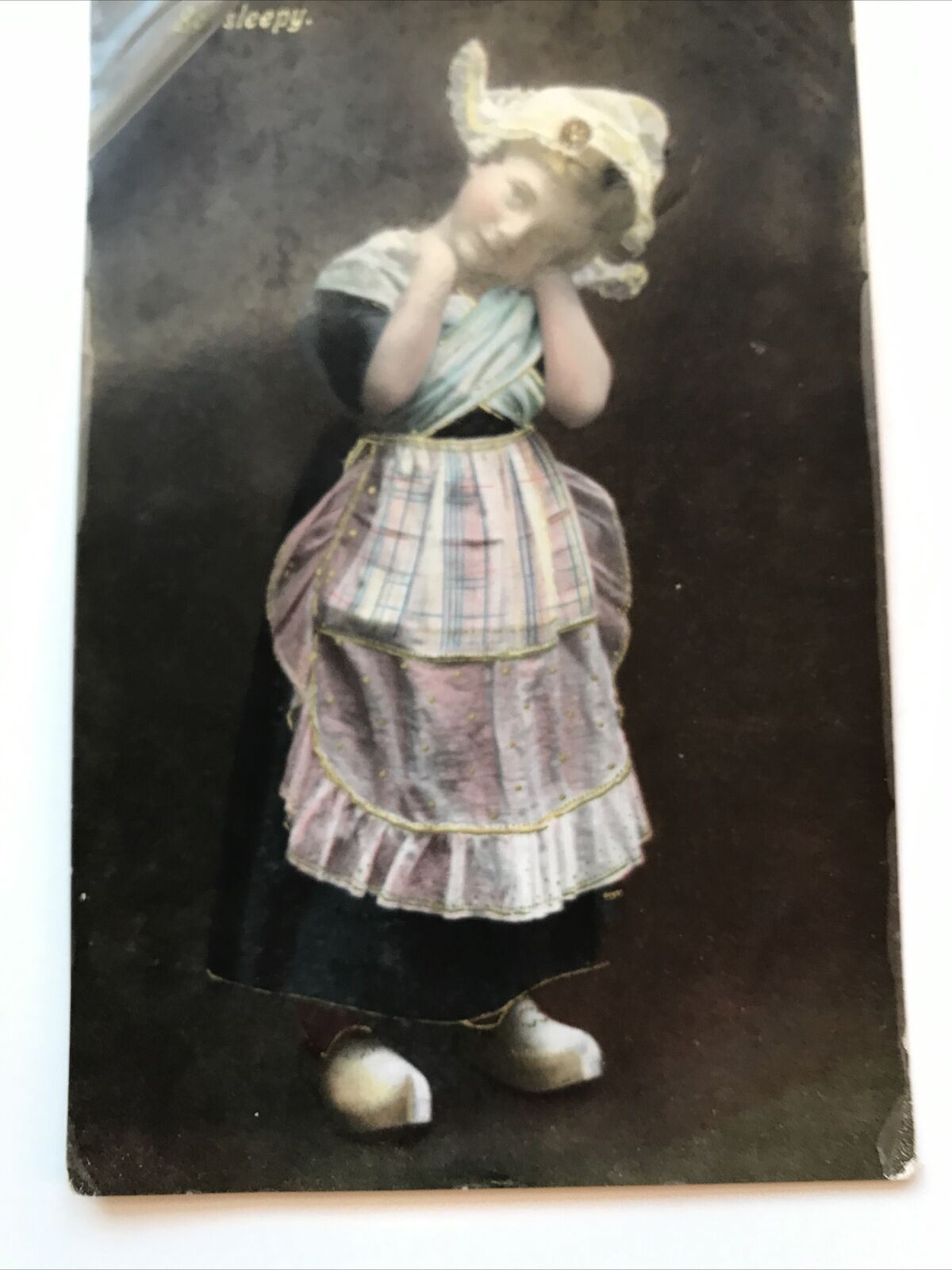 Antique C1905-1920 Philco RP Postcard Girl In Dutch Costume With Clogs. So Sleepy. Tinted.