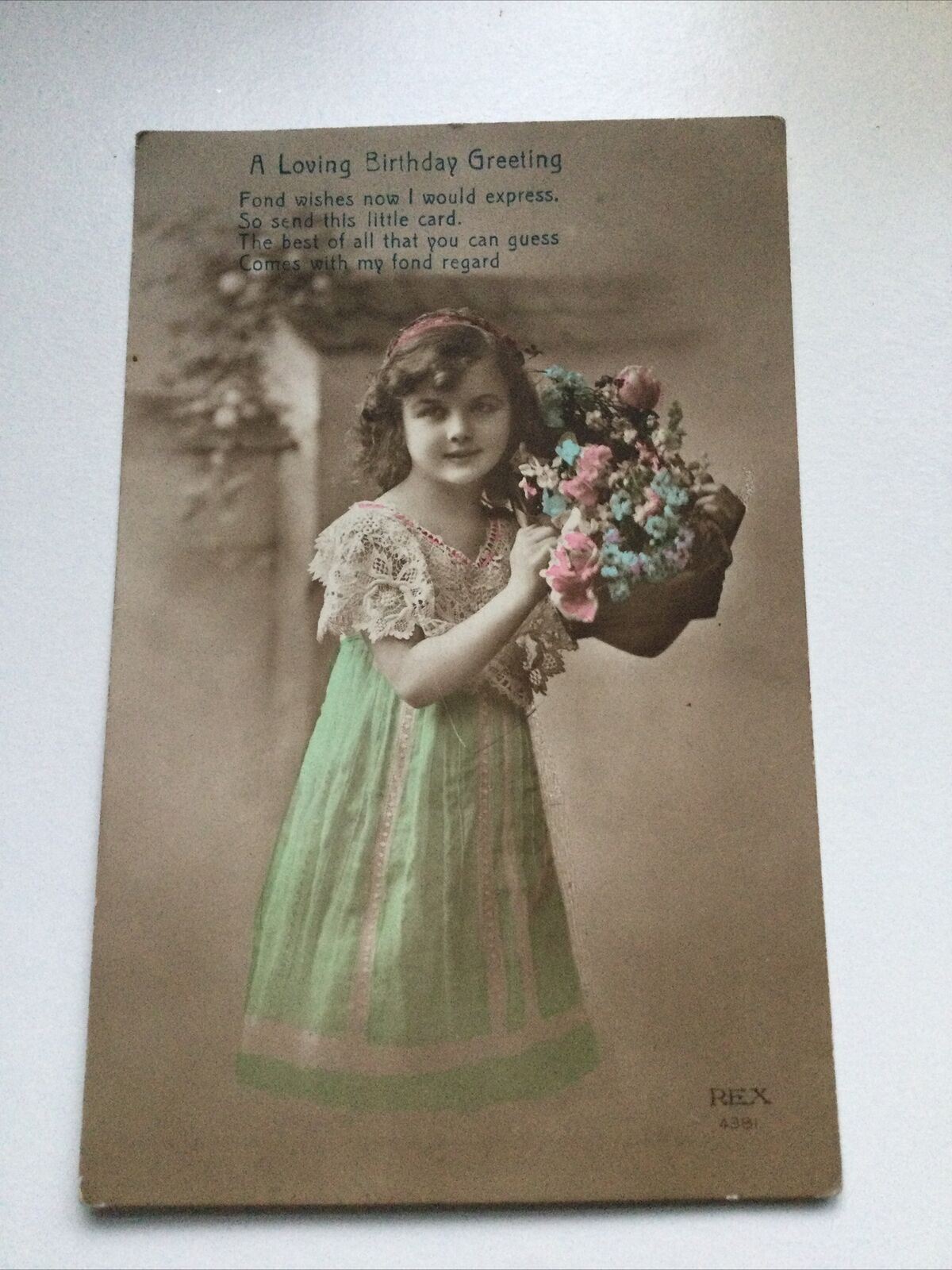 Antique Birthday Greetings Postcard Girl With Basket Of Flowers Ettlingers Hand tinted photo