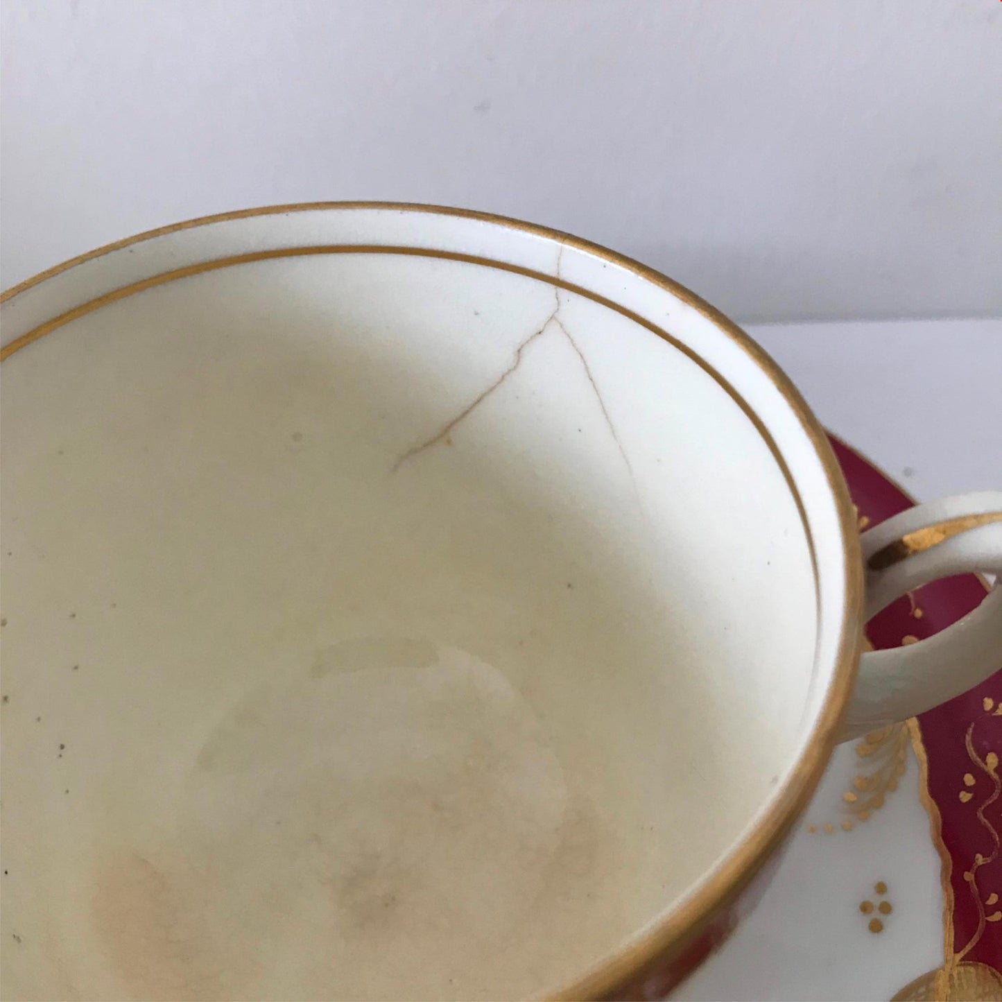 Festive bone china trio- cup, saucer, side plate. Deep pink & gold CRACKED CUP