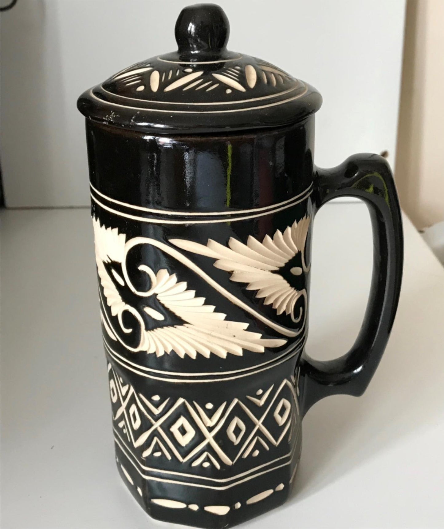Striking black and cream pottery lidded tankard from Sarawak, Borneo, Malaysia.