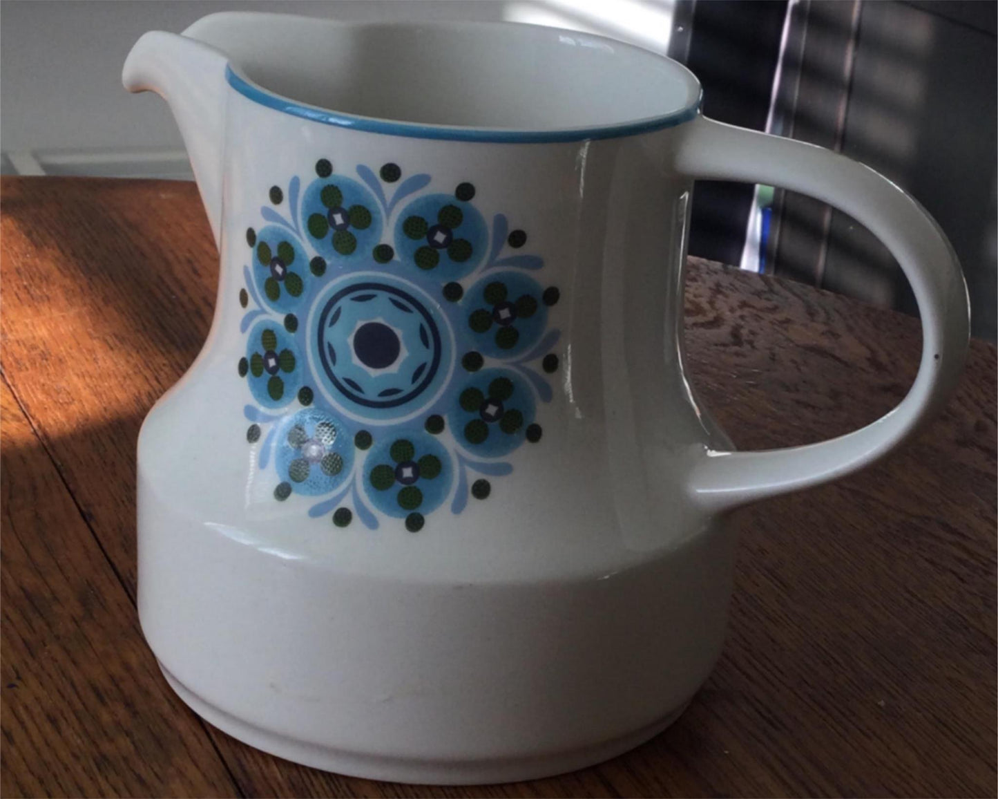 Vintage cheery pretty floral jug. White with retro blue stylised flowers. English 1960s.