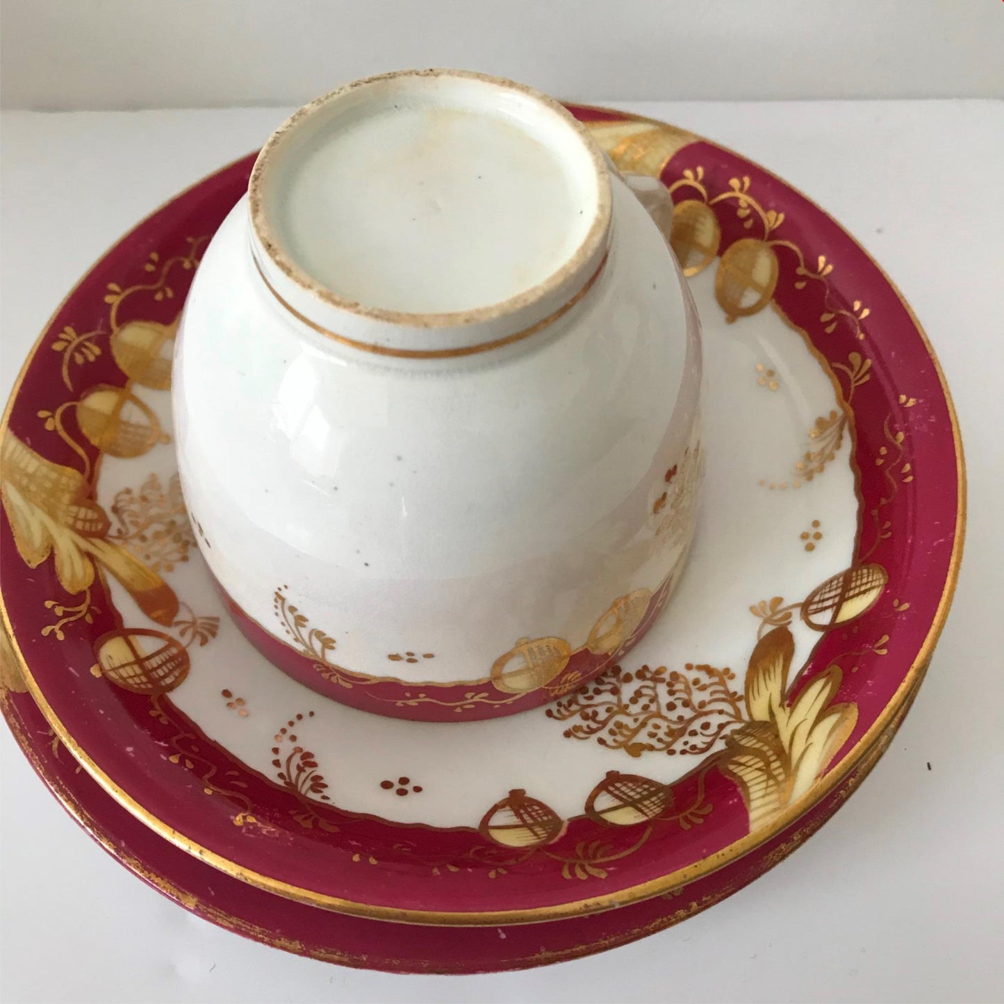Festive bone china trio- cup, saucer, side plate. Deep pink & gold CRACKED CUP