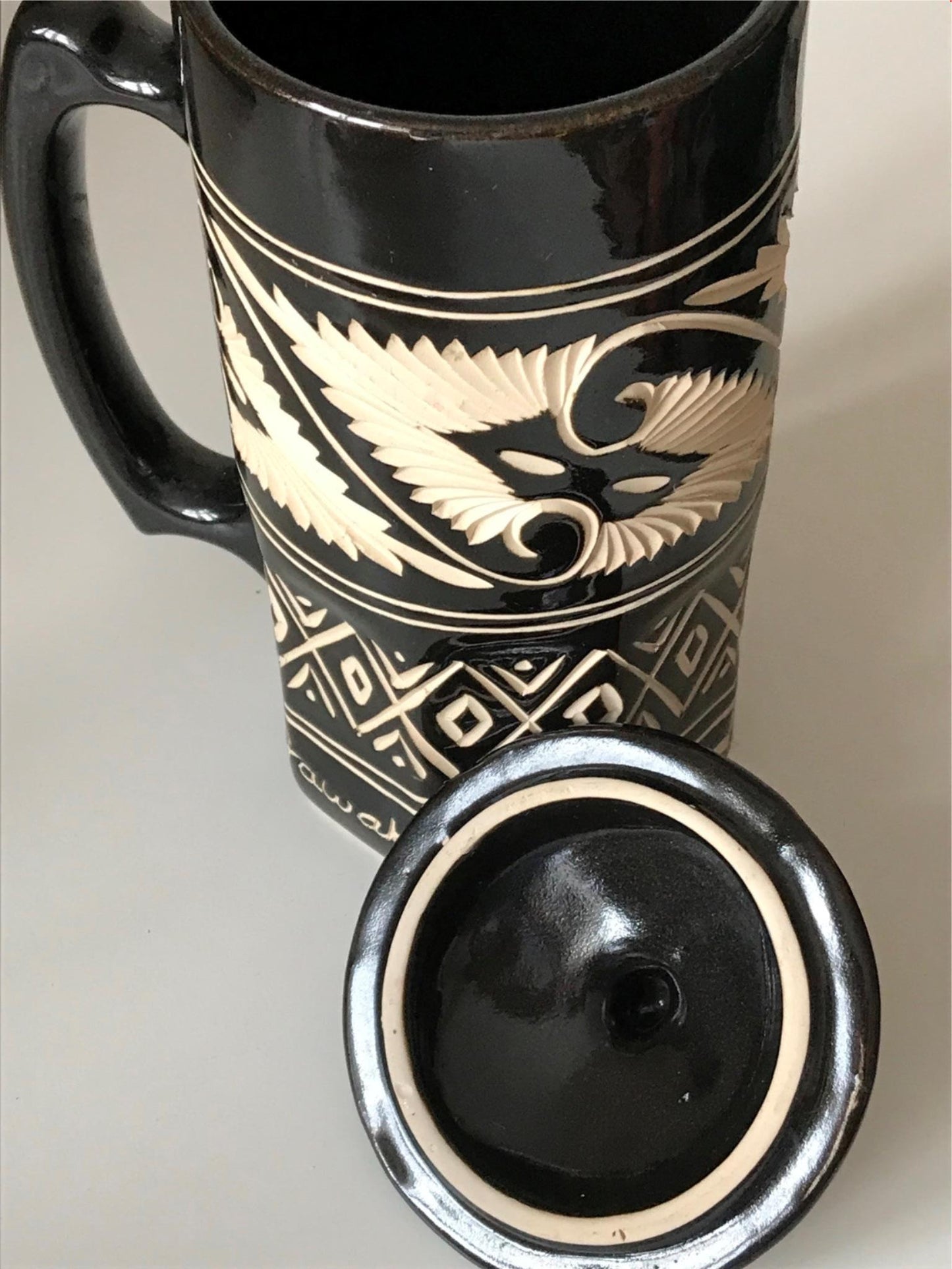 Striking black and cream pottery lidded tankard from Sarawak, Borneo, Malaysia.