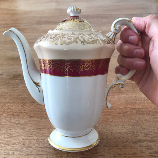 Vintage Paragon coffee pot. White, cream, burgundy and gold. Ornate design. Fancy handle and spout.