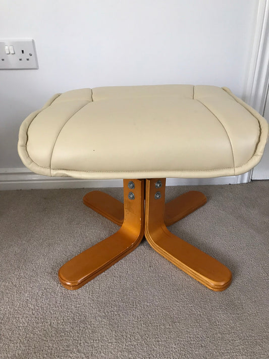 Cream faux leather footstool with wooden legs to match recliner chair.