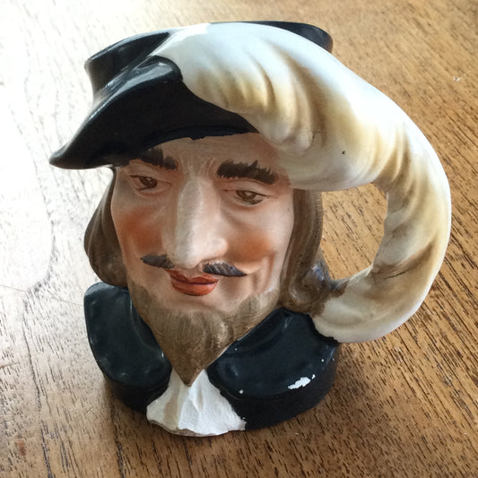 Vintage Shakespeare character / toby mug. Plume is the handle. Black and white. Some damage.