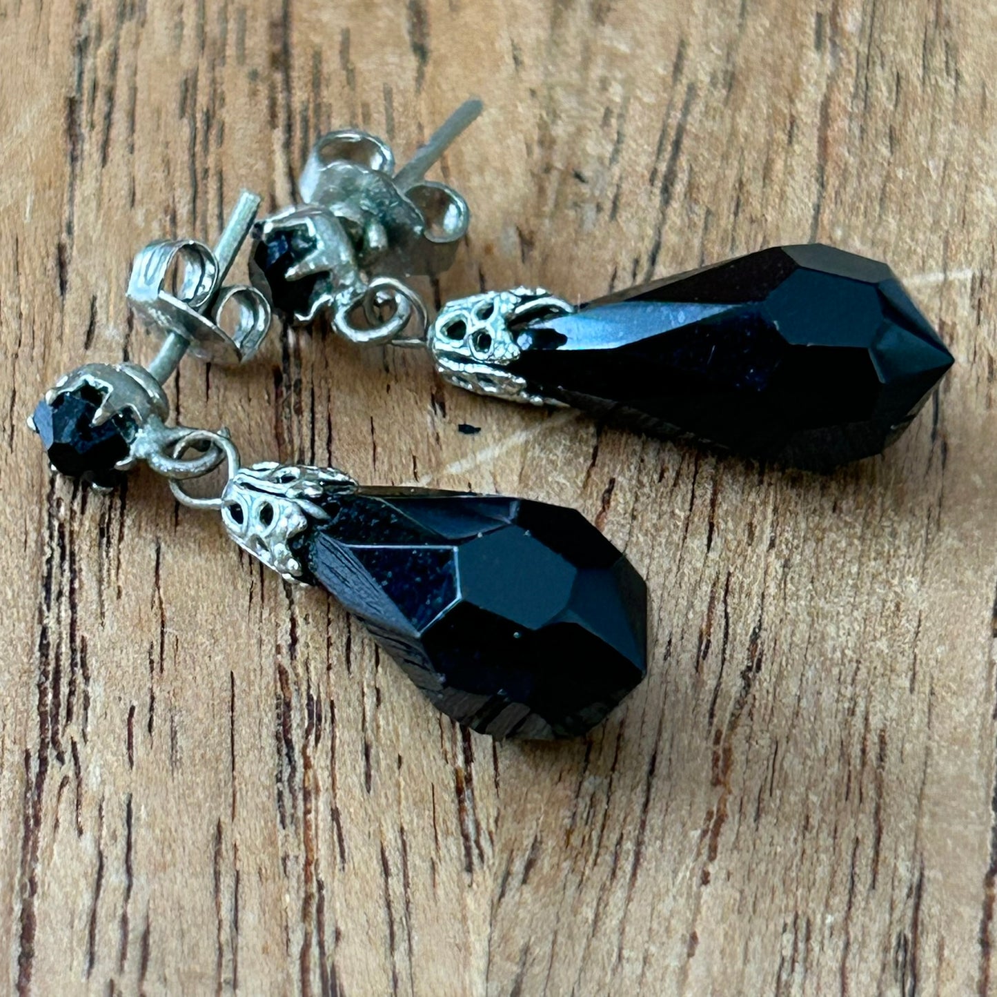 Pretty vintage drop earrings. Black faceted glass with silver tone metal. Classic teardrop shape design